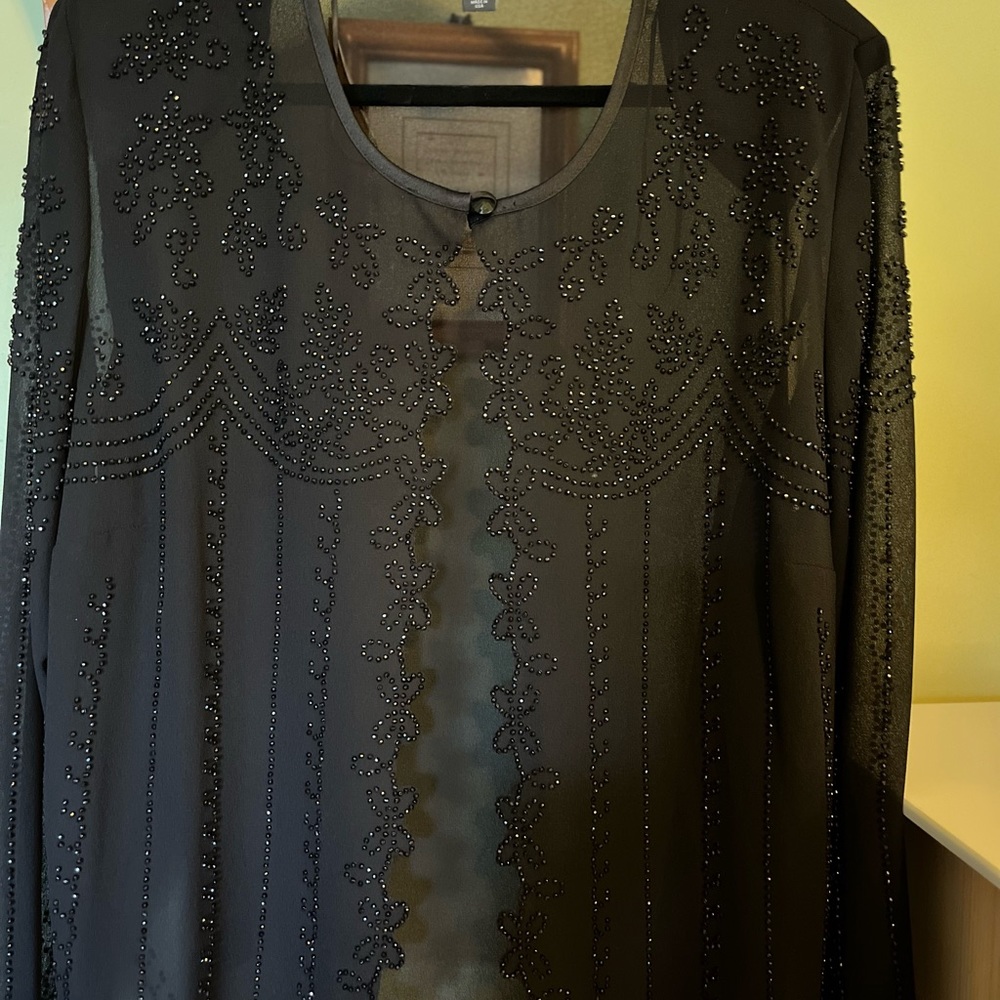 Black three piece pant suit.